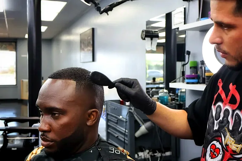 Barber lining up a haircut