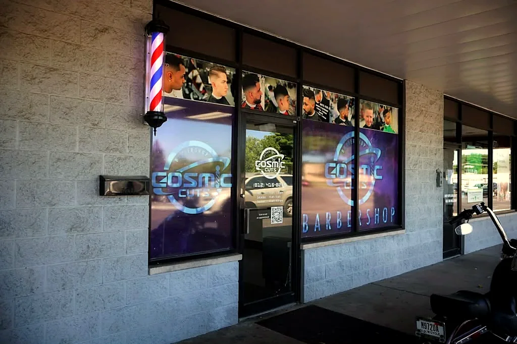 Cosmic Cuts storefront with the purple window logo